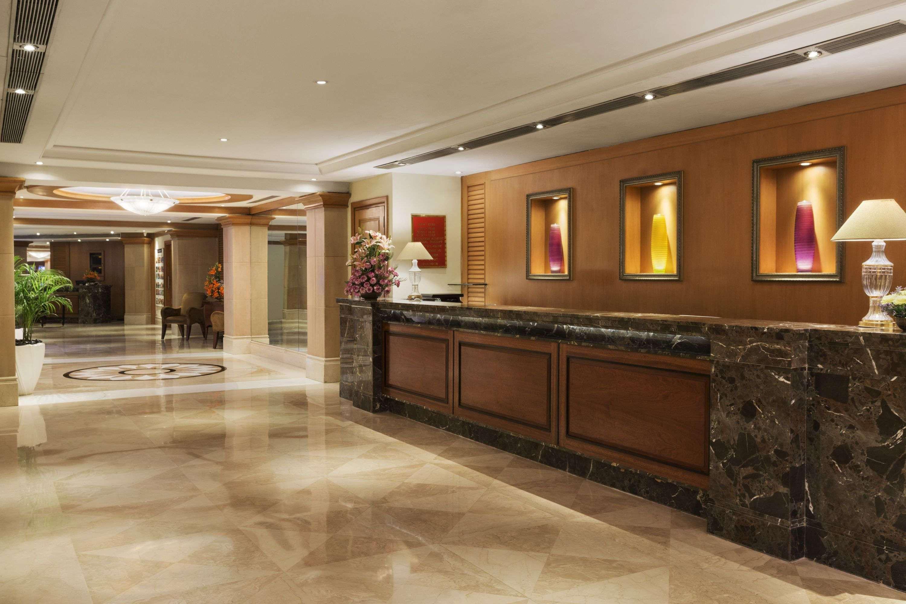 Hotel Ramada Plaza By Wyndham Palm Grove Mumbai Exterior foto The lobby of the hotel
